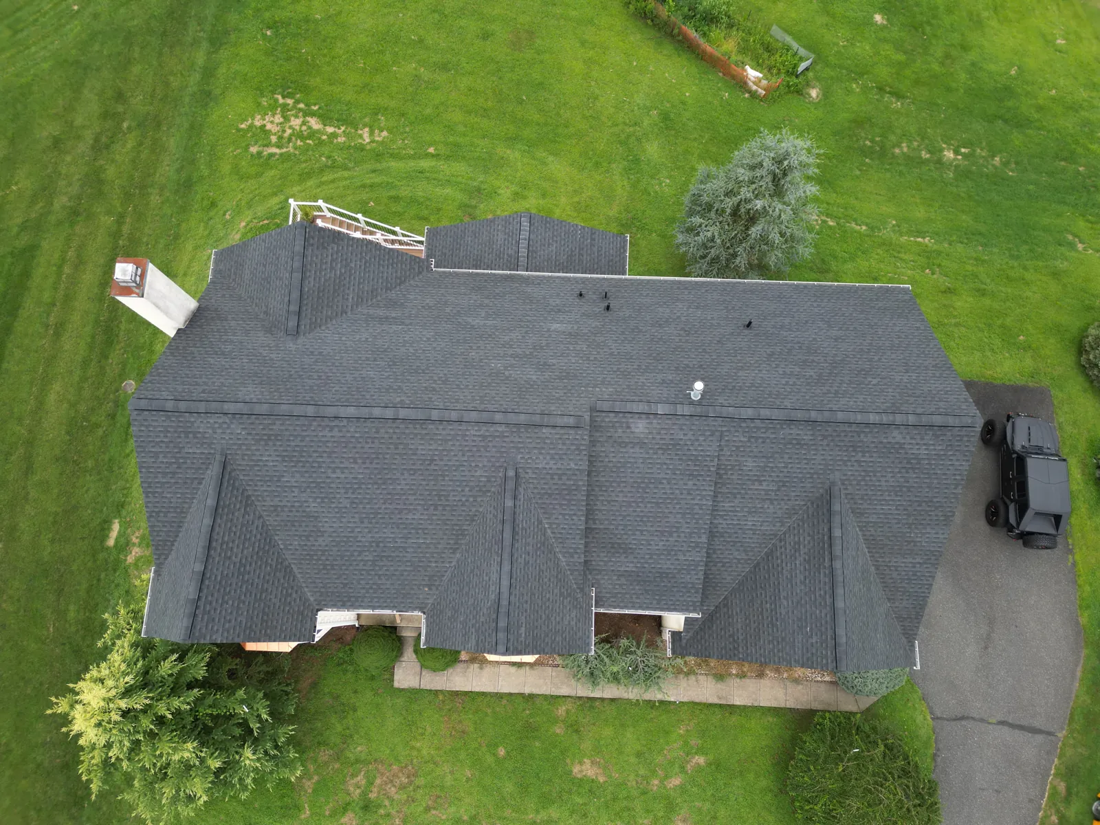Completed asphalt shingle roof replacement, aerial view