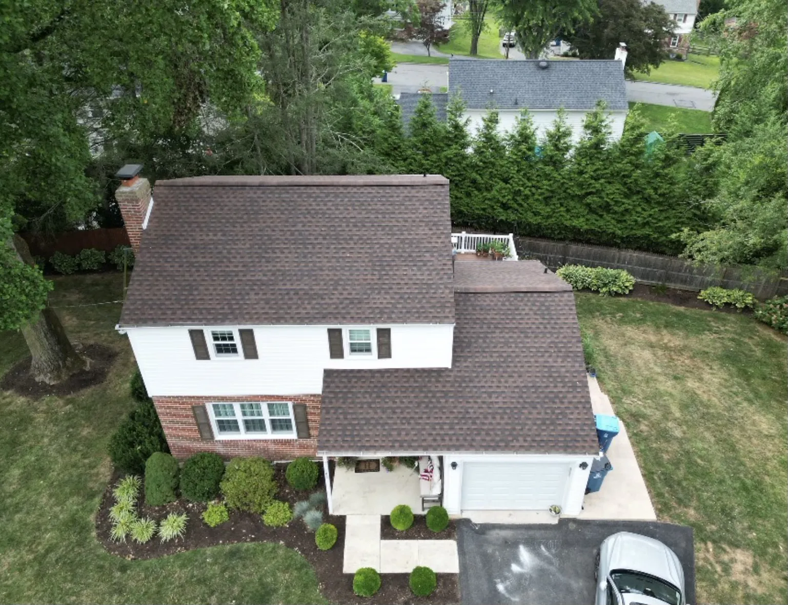 New brown architectural shingle roof on a colonial